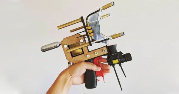 Man builds gun that shoots masks onto people’s faces Man builds gun that shoots masks onto people’s faces