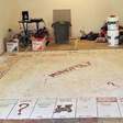 Homeowners find giant Monopoly board painted on the floor while tearing out the carpet