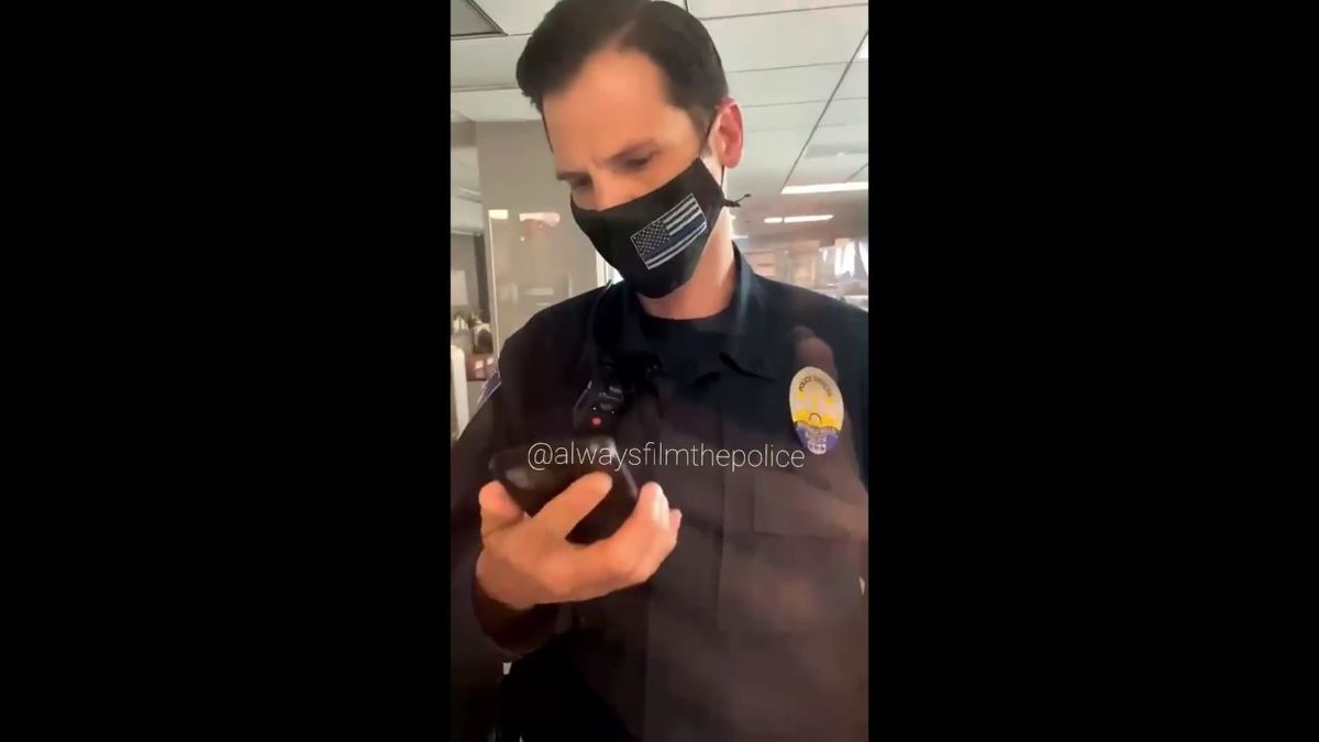 Police officer plays music to try and take down social media recording