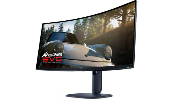 The monitor shown at an angle facing toward the slight left. It shows the slight curve and the nice simple base. White background. Racing game Assetto Corsa Evo is on screen.
